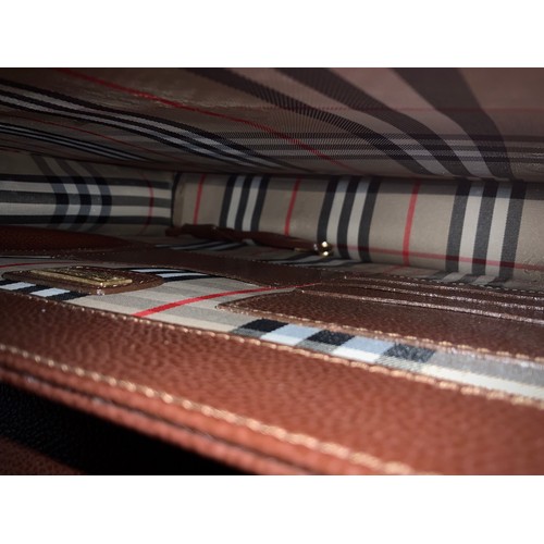 255 - Burberry brown leather briefcase, interlined Burberry material, fitted interior with pockets and com... 