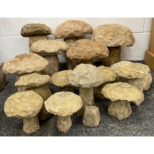 234 - A group of small Derbyshire Gristone straddle stones or decorative garden mushrooms, approx. 15.