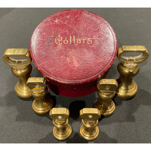 84 - A set of Victorian brass weights in a leather collar box