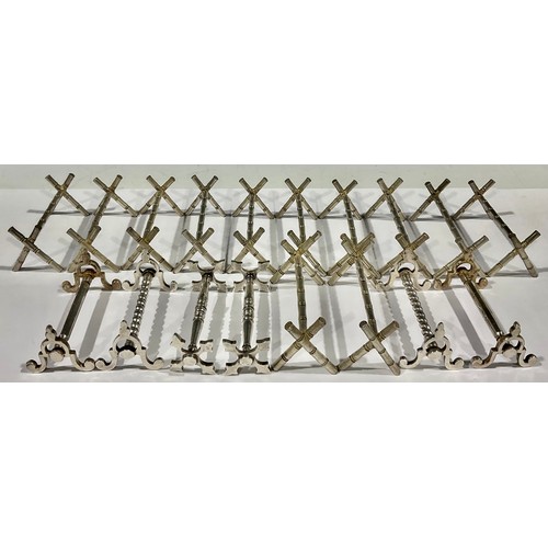 92 - A collection of nine Victorian silver plated pairs of knife rests