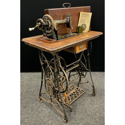 58 - A Frister & Rossmann Lockstitch sewing machine, with cast iron treadle base, number 1288422, c.1910.