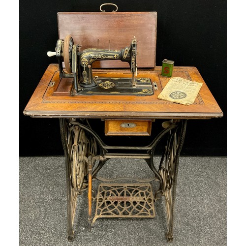 58 - A Frister & Rossmann Lockstitch sewing machine, with cast iron treadle base, number 1288422, c.1910.