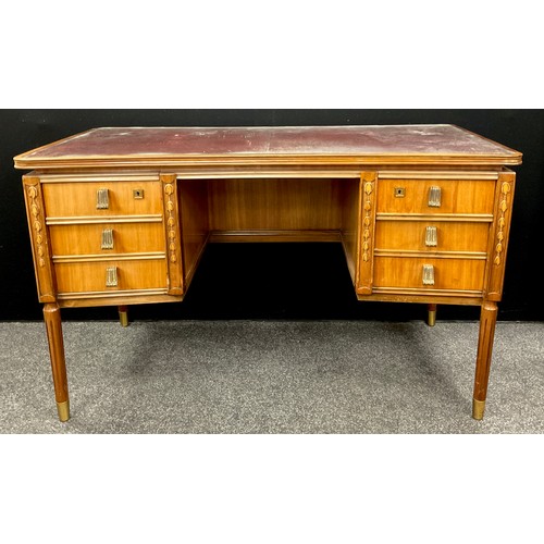 59 - A French walnut writing desk, in the Louis XVI style, with inverted bow-front rectangular top, inset... 