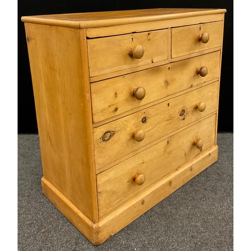 61 - A pine chest of two over three graduated long drawers, 101cm high x 102cm wide x 52.5cm deep.