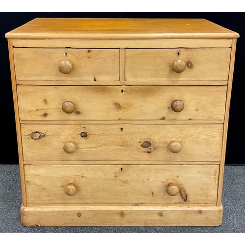 61 - A pine chest of two over three graduated long drawers, 101cm high x 102cm wide x 52.5cm deep.