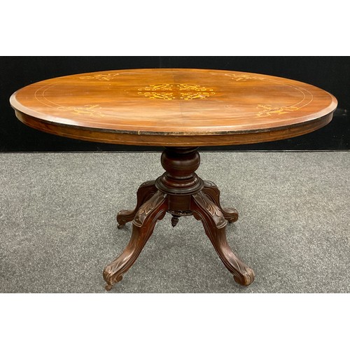 68 - A late 19th century walnut veneered Loo table, tilting oval top with boxwood inlay, carved pedestal ... 