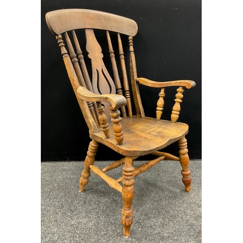 76 - A Late Victorian elm and beech armchair, lyre and spindle-back, double H-stretcher, turned legs, 110... 