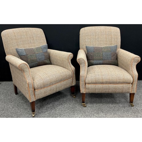 208 - A pair of Harris Tweed armchairs, tapering square legs, brass casters, 88cm high x 72cm wide x 79cm ... 