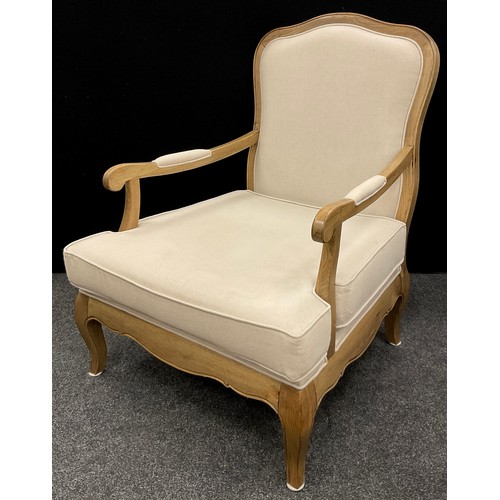 211 - A pair of French Provincial style deep-seated elm armchairs, and a conforming footstool, the chairs ... 