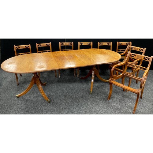 204 - A regency style yew wood reproduction D-end dining table (with additional leaf), and a set of matchi... 