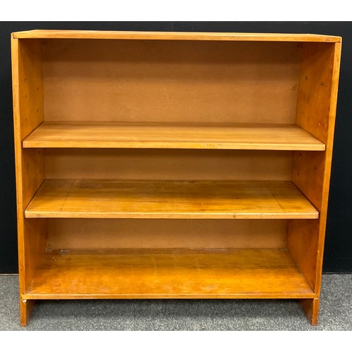 223 - A pine open bookcase, three tiers of deep shelving, 112cm high x 114.5cm wide x 30.5cm deep.