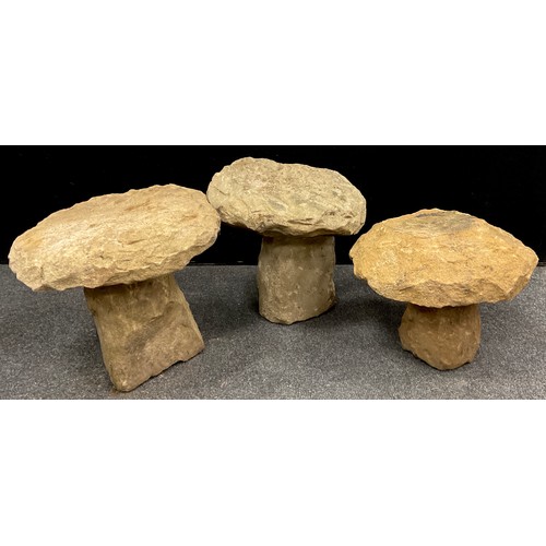 228 - A group of three Derbyshire gritstone staddle stones, the largest measuring 36cm high x 36.5cm x 34c... 