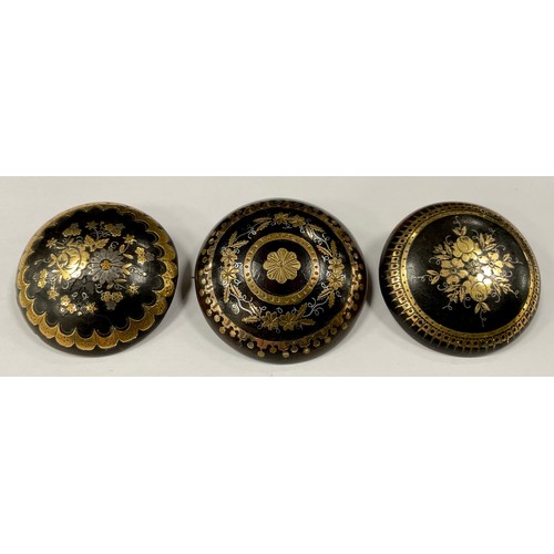 356 - Three 19th century Pique ware buttons, largest approx 38mm diameter, decorated with floral sprays an... 