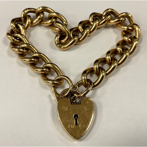 358 - A heavy weight 9ct gold solid curb link bracelet, padlock clasp,  59.4g gross