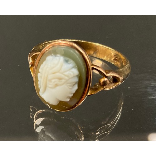 383 - A cameo hardstone panel ring, Portrait of a maiden possibly Minerva, open shouldered shank, stamped ... 