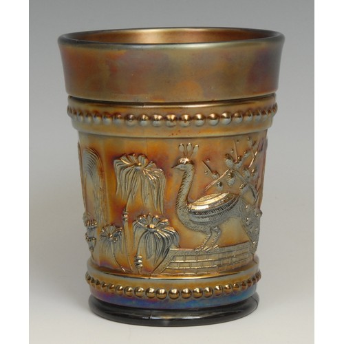 39 - An American Northwood amethyst carnival glass beaker, moulded with peacocks and fountains, 10cm, mou... 