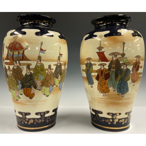 72 - A pair of Japanese export ware decorative satsuma style baluster vases, printed and painted with fig... 