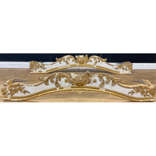 109 - A pair of Italian Rococo Revival parcel-gilt pelmets, the largest 178cm wide, the other 167cm wide (... 