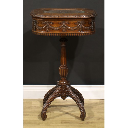 115 - An Adam Revival mahogany work table, hinged top above a deep frieze carved and applied with ribbon-t... 