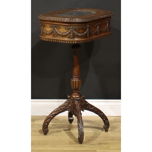 115 - An Adam Revival mahogany work table, hinged top above a deep frieze carved and applied with ribbon-t... 