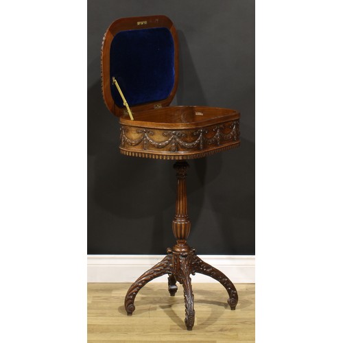 115 - An Adam Revival mahogany work table, hinged top above a deep frieze carved and applied with ribbon-t... 