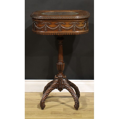 115 - An Adam Revival mahogany work table, hinged top above a deep frieze carved and applied with ribbon-t... 