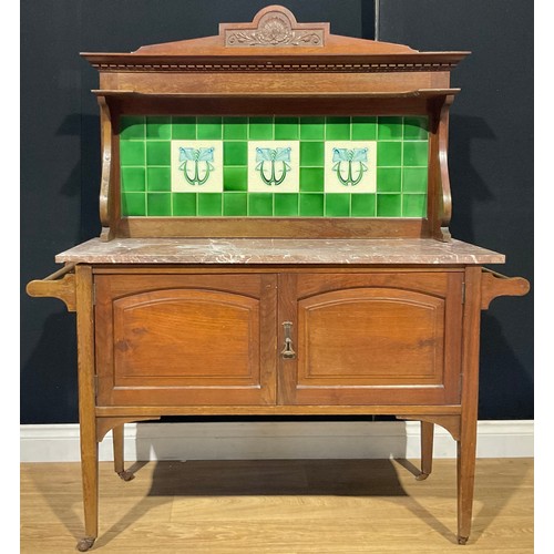 118 - An Art Nouveau walnut tile back washstand, 122cm wide, c.1900