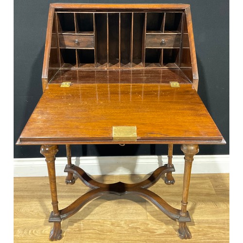 111 - A William and Mary style mahogany and walnut veneered bureau on stand, fall front, cross banded and ... 