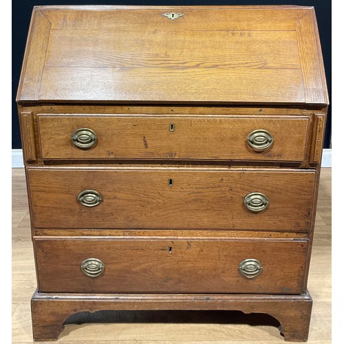 625 - A George III oak bureau, fall front enclosing small drawers and pigeonholes, above three long drawer... 