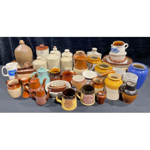 628 - Kitchenalia - a quantity of stoneware, including footwarmers, cooking pots and bowls, preserve jars,... 