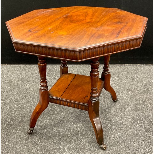 63 - An Edwardian walnut octagonal occasional table, carved frieze, turned supports, with under-tier shel... 