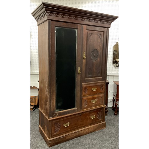 66 - A late Victorian mahogany, and mahogany veneer wardrobe, large out-swept cornice above a single tall... 