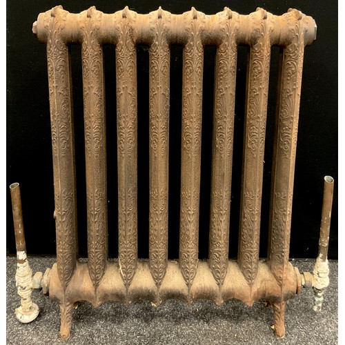 72 - Architectural Salvage - a Victorian cast iron eight section radiator, with rococo style decoration i... 