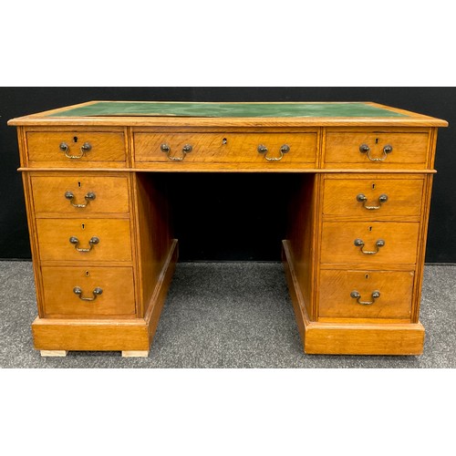 82 - An early 20th century oak pedestal desk, 75.5cm high x 122cm wide x 67.5cm deep.