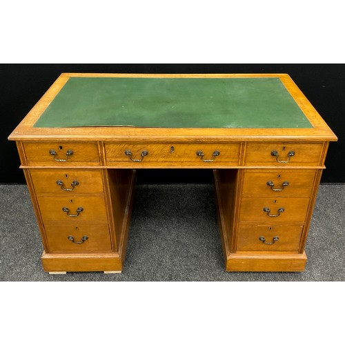 82 - An early 20th century oak pedestal desk, 75.5cm high x 122cm wide x 67.5cm deep.