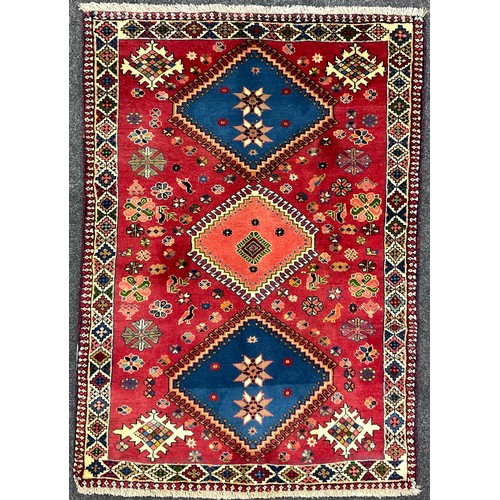 83 - A North West Persian Yallemeh rug / carpet, hand-knotted with a row of three diamond-shaped medallio... 