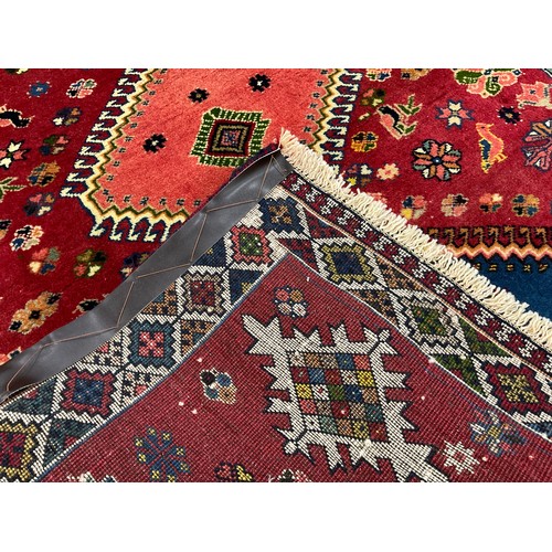 83 - A North West Persian Yallemeh rug / carpet, hand-knotted with a row of three diamond-shaped medallio... 