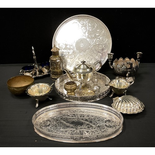 110 - Metal ware including; galleried trays, a three piece Sheffield silver plated tea set, Viners posie a... 