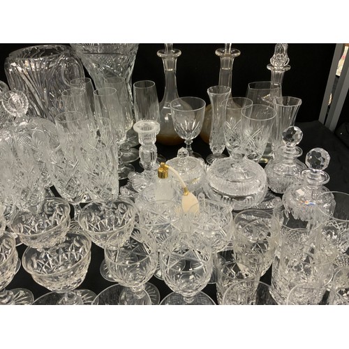 143 - Glassware - a quantity of 19th century and later glass including decanters, vases, etched glass, cut... 