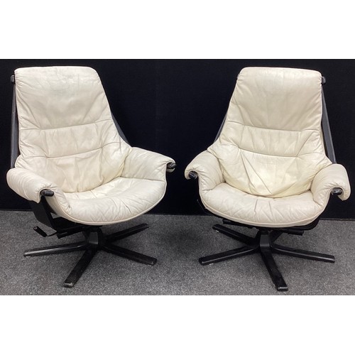 190 - Scandinavian design - A pair of Möbel of Sweden, rise and recline, swivel ‘easy chairs’, (2).