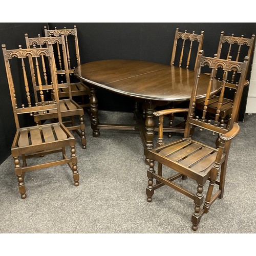 194 - An Ercol Elm extending dining table, with set of six Ercol ‘Old Colonial’ design chairs, inc. pair o... 