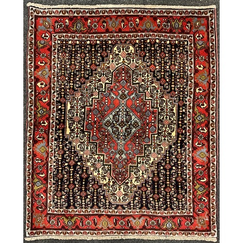 201 - A North West Persian Senneh rug / carpet, hand-knotted with a central diamond-shaped medallion, in s... 