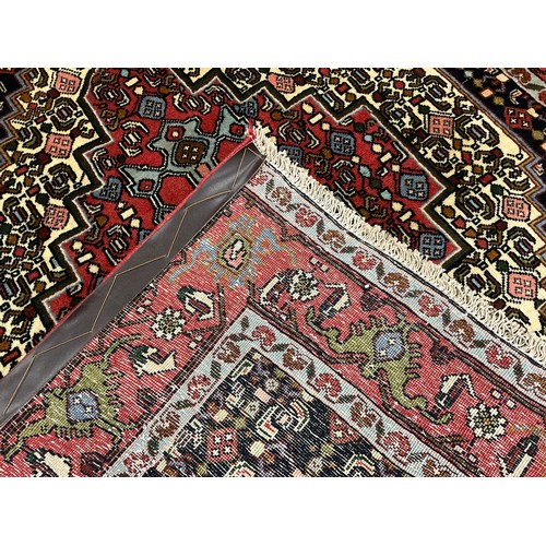 201 - A North West Persian Senneh rug / carpet, hand-knotted with a central diamond-shaped medallion, in s... 