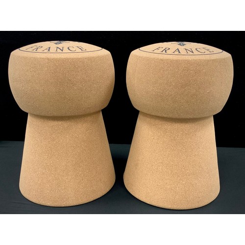 204 - A pair of enlarged champagne cork stools, 50cm high (2)