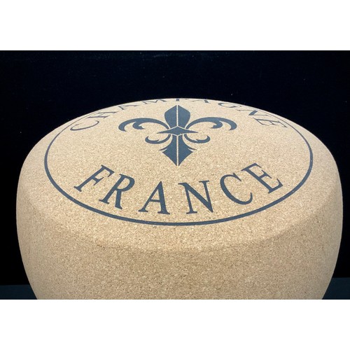 204 - A pair of enlarged champagne cork stools, 50cm high (2)