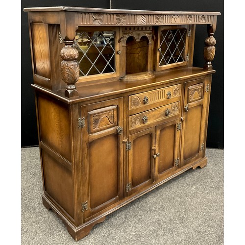 214 - A Stanley Wood elm court cupboard, 138cm high x 141.5cm wide x 47.5cm deep.