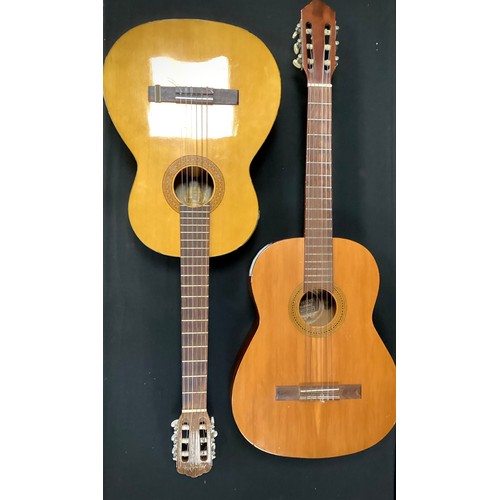 234 - Musical instruments - A Landola C-65 model acoustic guitar, made in Finland;  and a Dulcet Classic, ... 