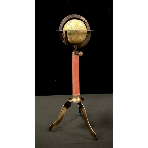 258 - A miniature terrestrial globe on tri-pod stand, 29cm high