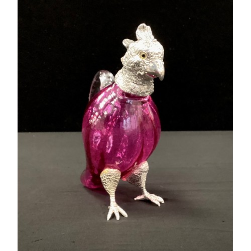 260 - A cranberry glass and silver plated claret jug, as a exotic bird, 17cm high