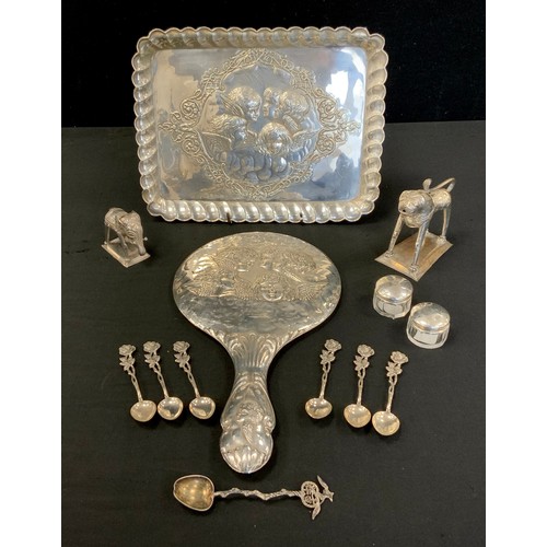 302 - A George V silver embossed dressing table tray, Birmingham 1916, 166g;  similar hand mirror, each em... 